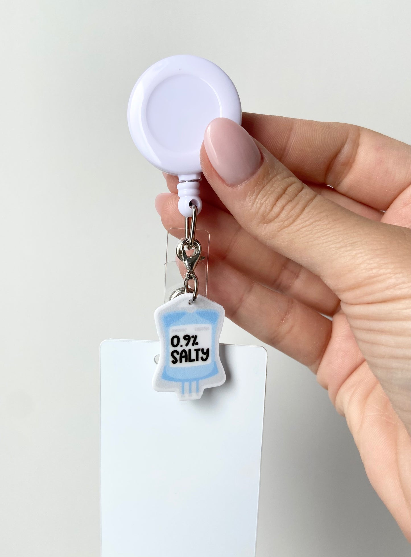 0.9% Salty Badge Charm